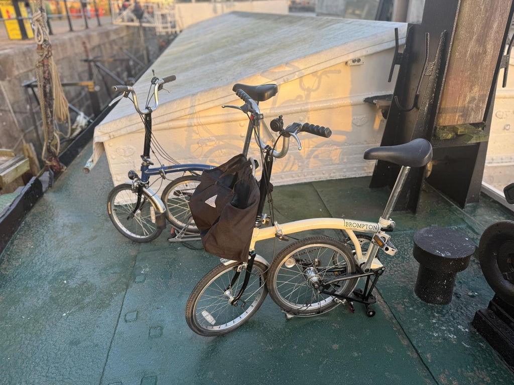 2 Bromptons. 1 x   Navy 6 Speed DYNAMO Light 1 x cream 5 speed.