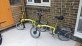 A Pair of Yellow Bromton Bikes In Excellent Condition with Conversion Kit