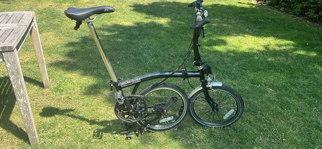Brompton S2L Folding Bike black plus Brompton/Ortlieb blue front bag
