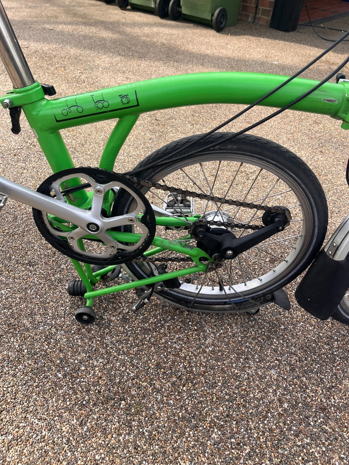 Lime green Brompton folding bike 3 speed