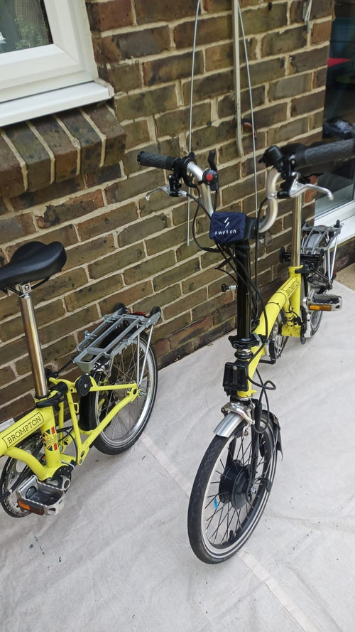 A Pair of Yellow Bromton Bikes In Excellent Condition with Conversion Kit