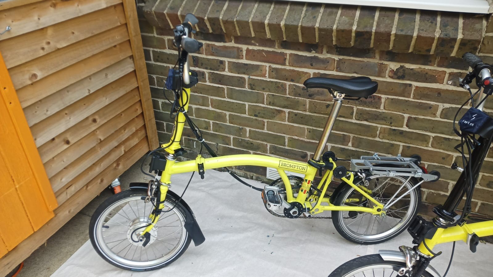 A Pair of Yellow Bromton Bikes In Excellent Condition with Conversion Kit