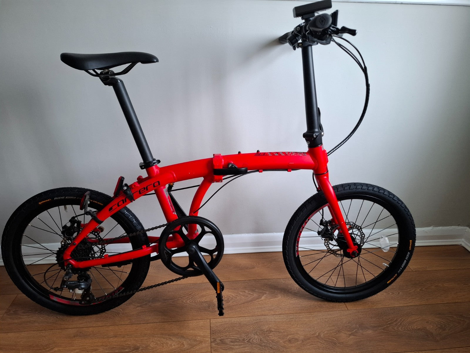Carrera Intercity Disc 8-Speed Folding Bike With Accessories and more