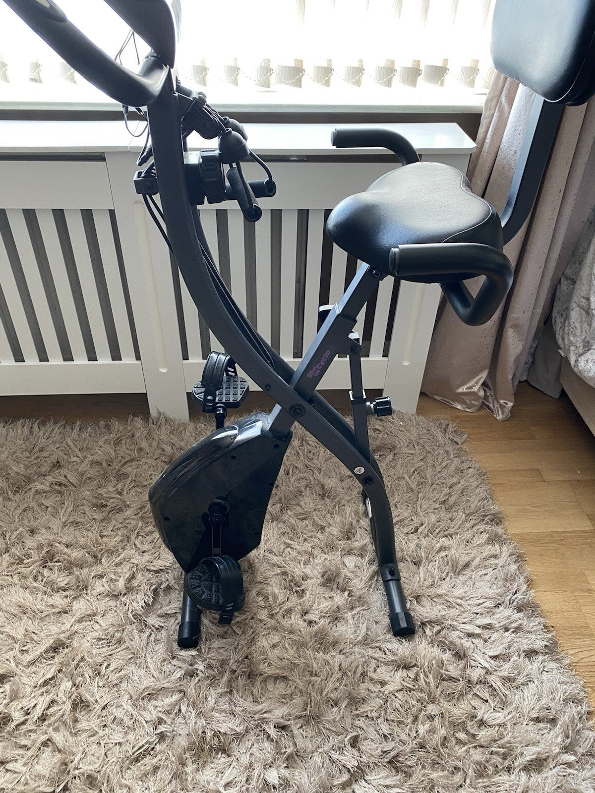 Slim Cycle foldable exercise bike worth over £200. Compact and sturdy