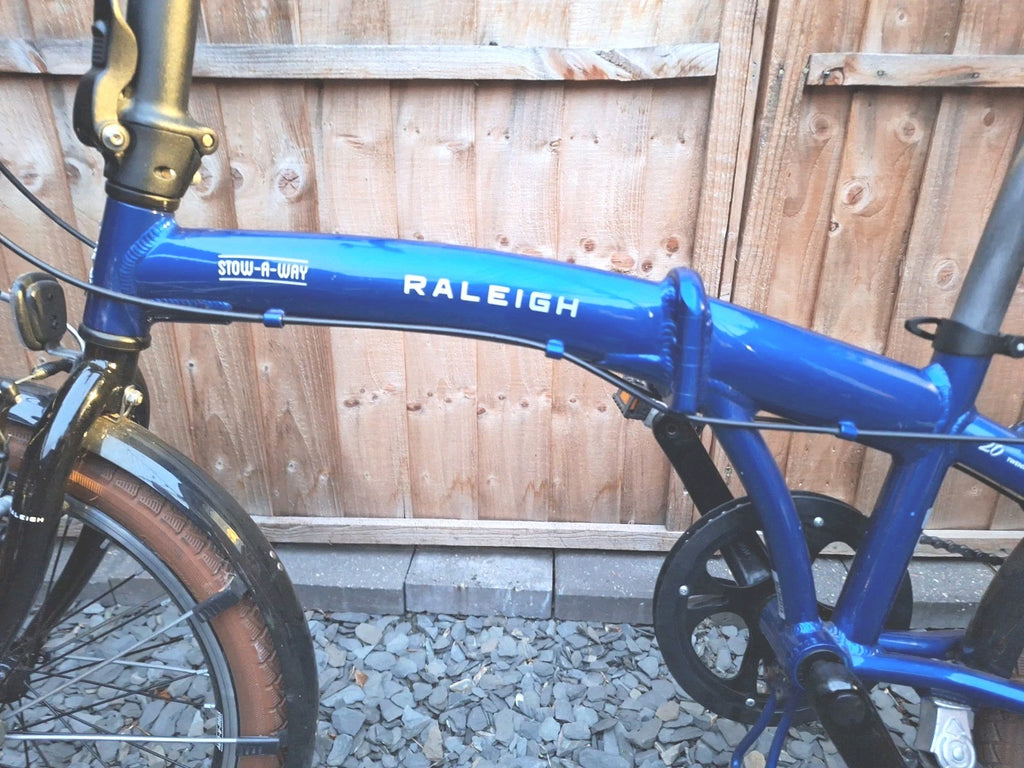 Raleigh Stowaway Folding Bike Unisex 7-Speed Hybrid Bicycle Blue  Mudgaurds Rack