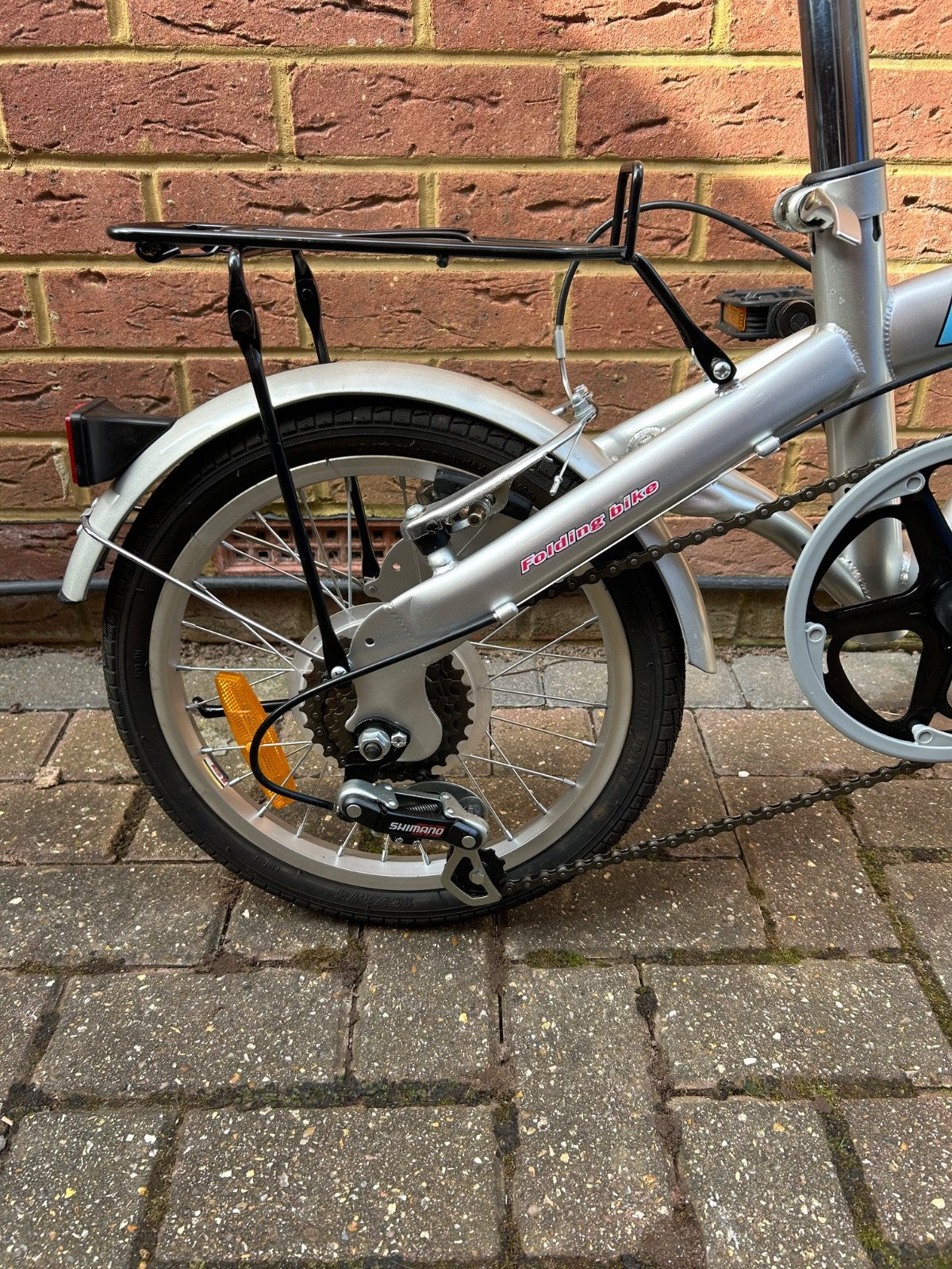 silver unisex fold up bike, aluminium alloy, never used