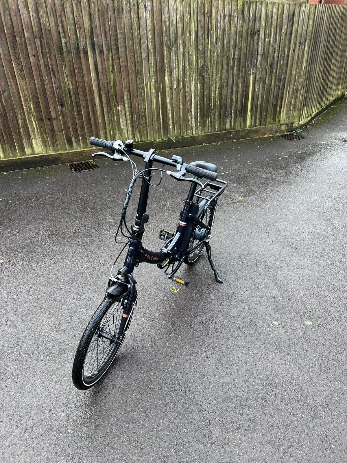 Raleigh Stow-E-Way Folding Bike In Dark Blue Designed to be packed away
