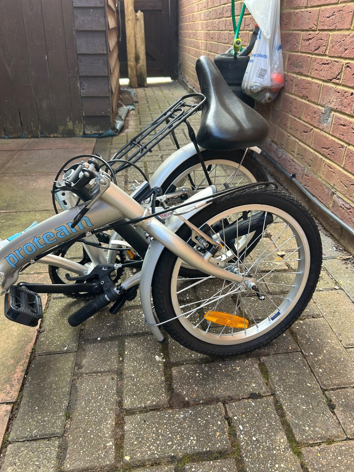 silver unisex fold up bike, aluminium alloy, never used