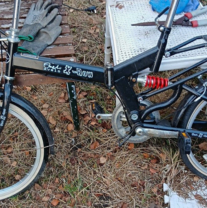 Vélo 20in Black Folding Bike with Rear Suspension, "Rock 'n' Row" Decal