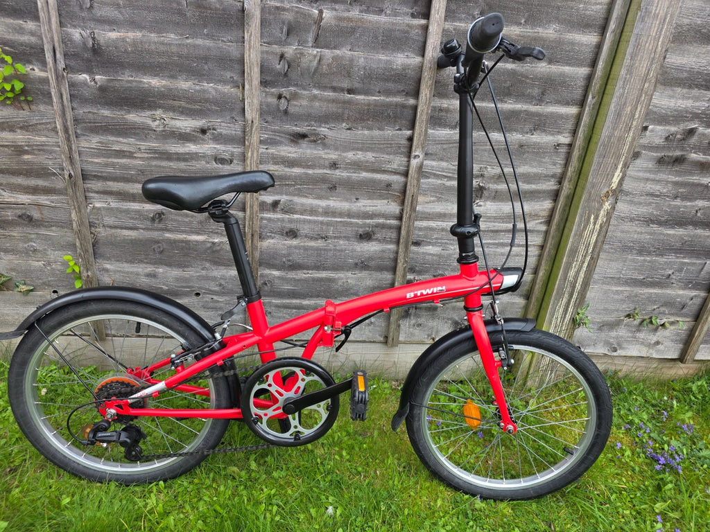Btwin pre-owned folding bike, red, in very good conditions + bonus (sturdy bag)