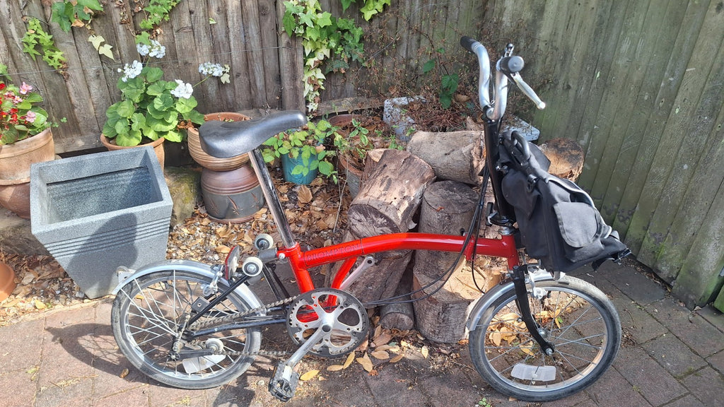 Brompton S3L Folding Bike 3-Speed . With front pannier bag and bike storage bag.