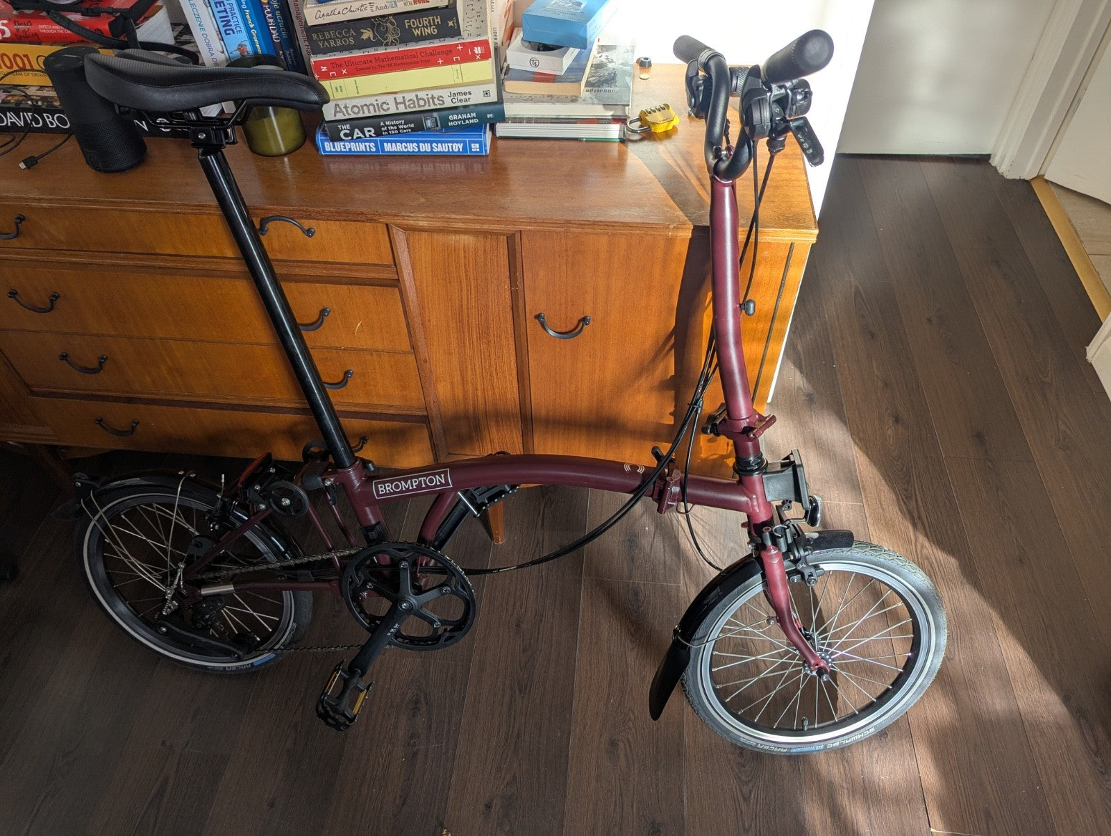 Brompton bike C-line 12-speed 2026 mid bar in Burgundy colour