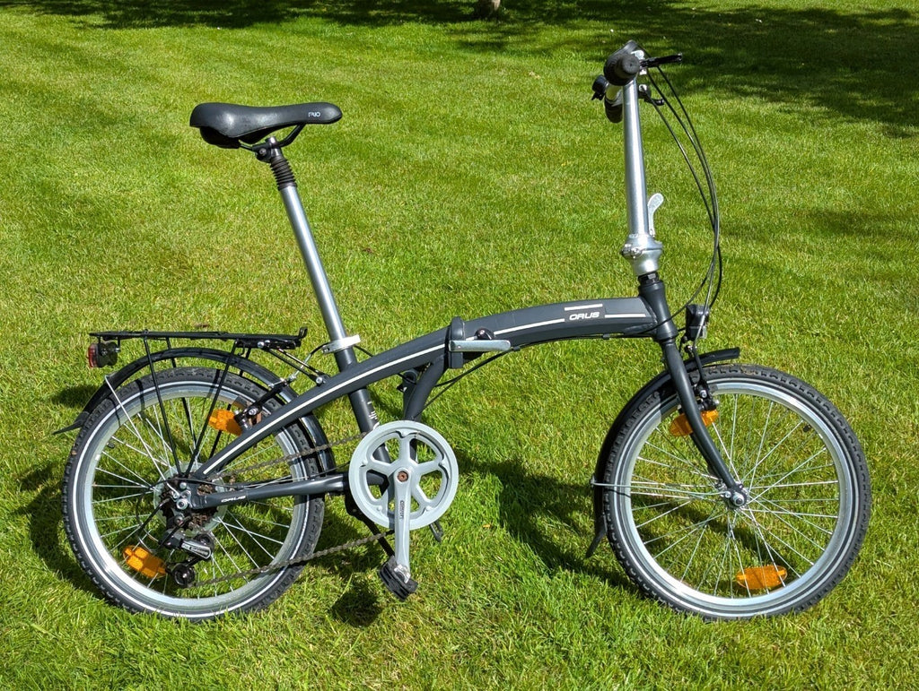 Folding Adult Bicycle with 7 speed Shimano gears, stand, lights, and pannier.
