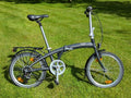 Folding Adult Bicycle with 7 speed Shimano gears, stand, lights, and pannier.