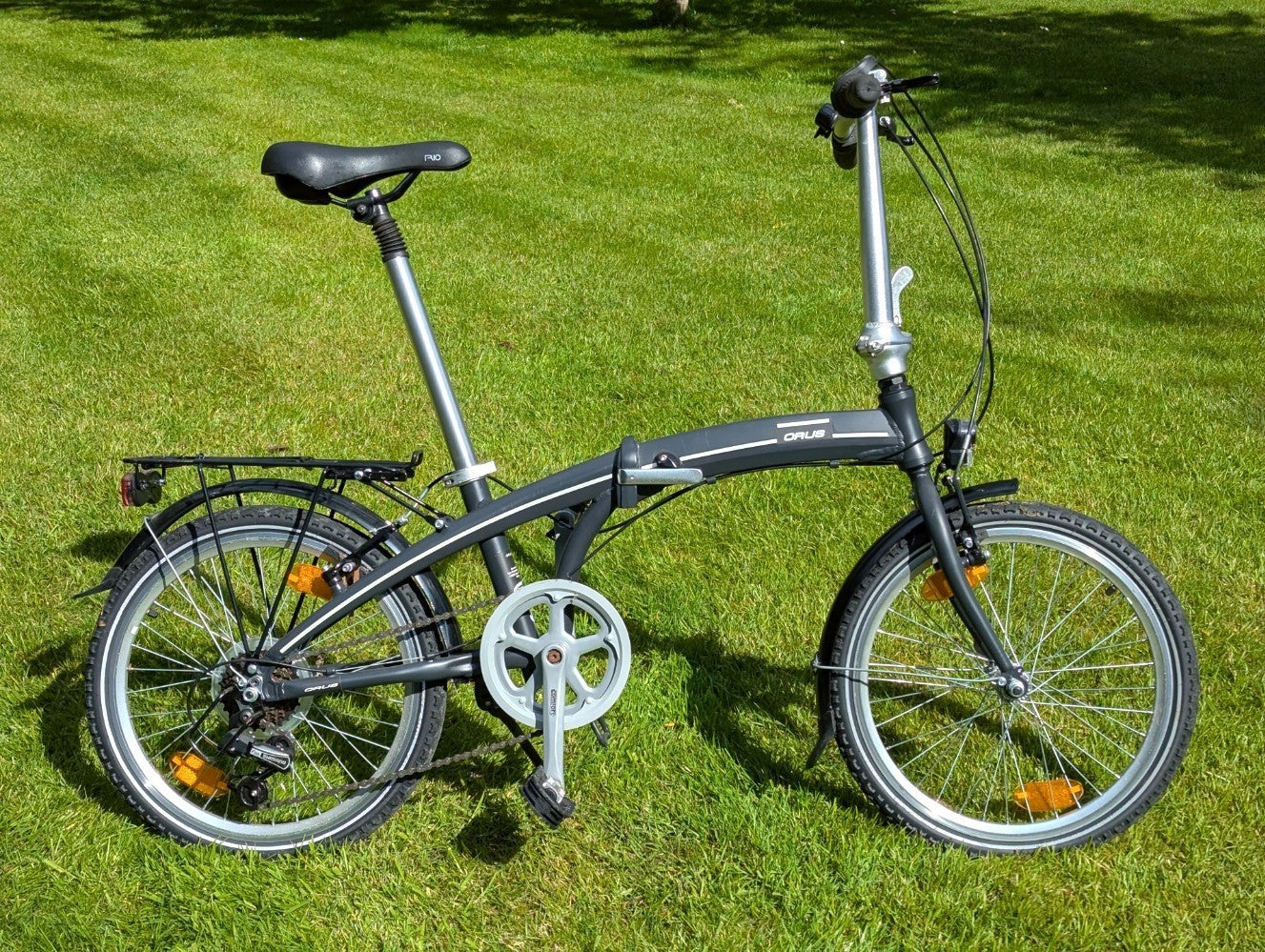 Folding Adult Bicycle with 7 speed Shimano gears, stand, lights, and pannier.