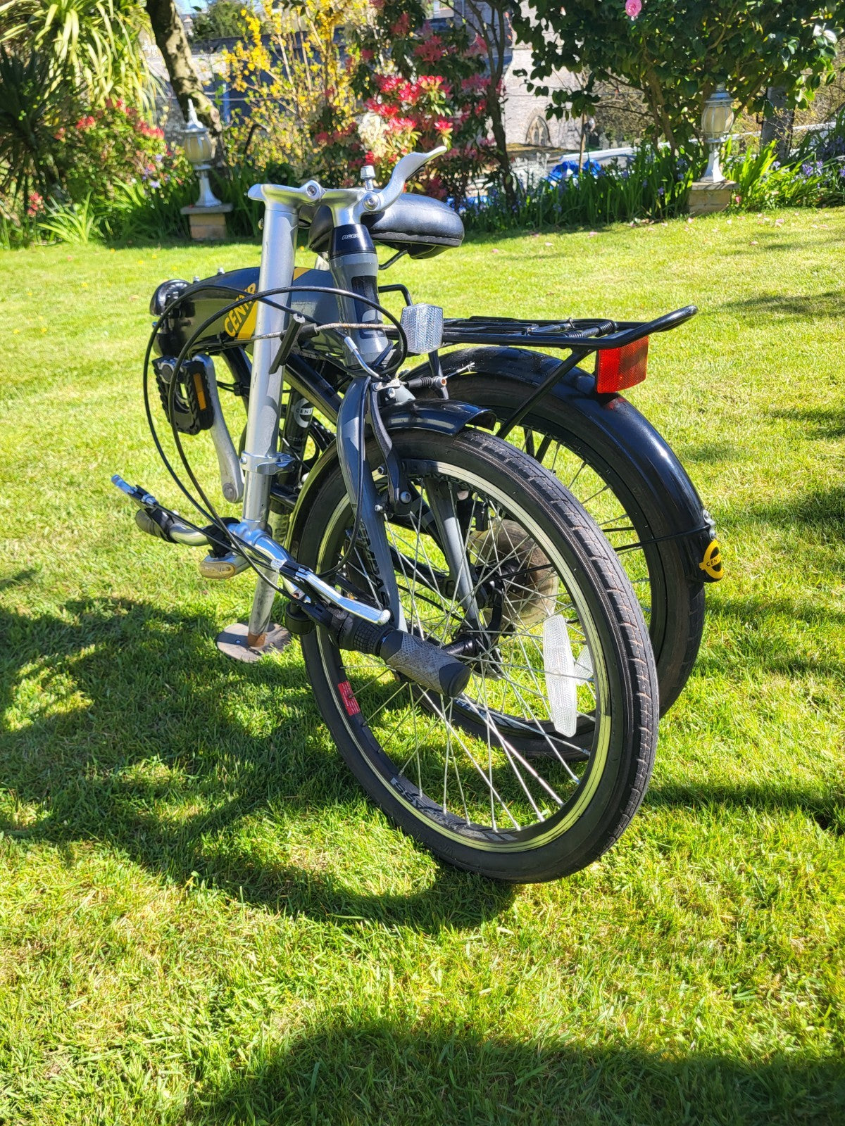 Compass Central  20in Folding Bicycles X  2, one white, one black.