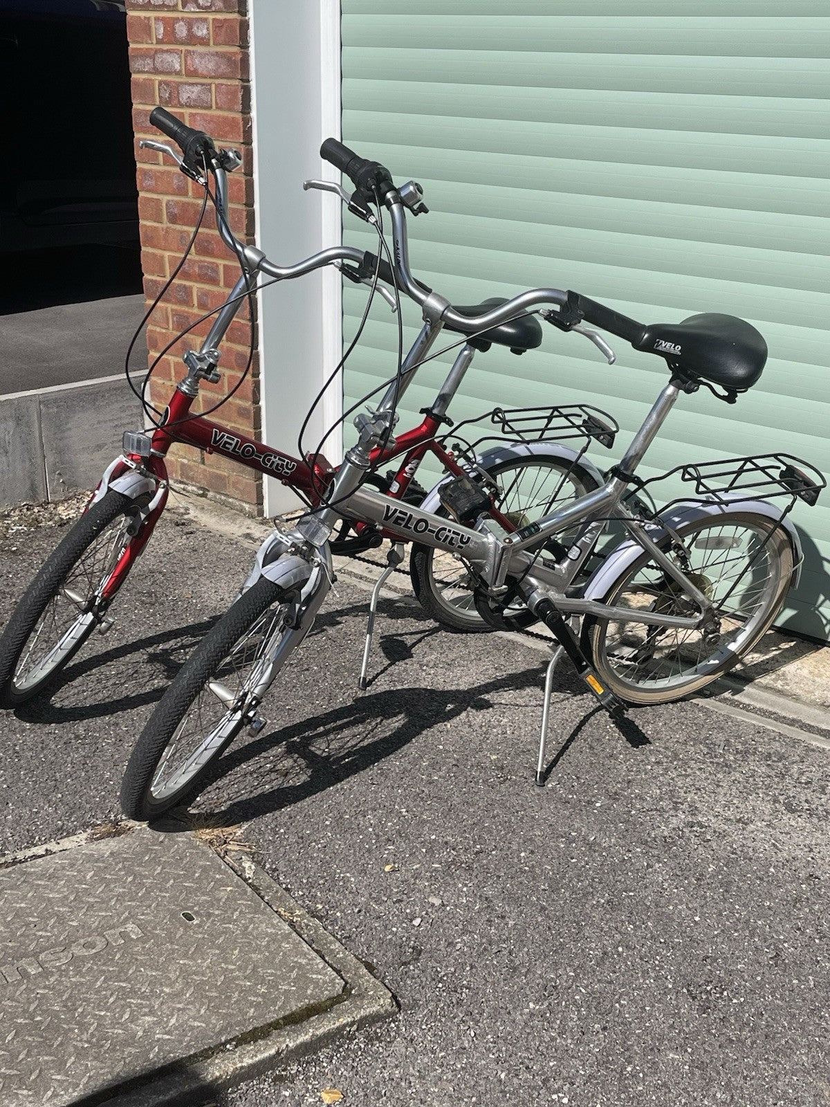 A Pair Of Velo-city 5 Speed Folding Bikes In Good Condition With Bags
