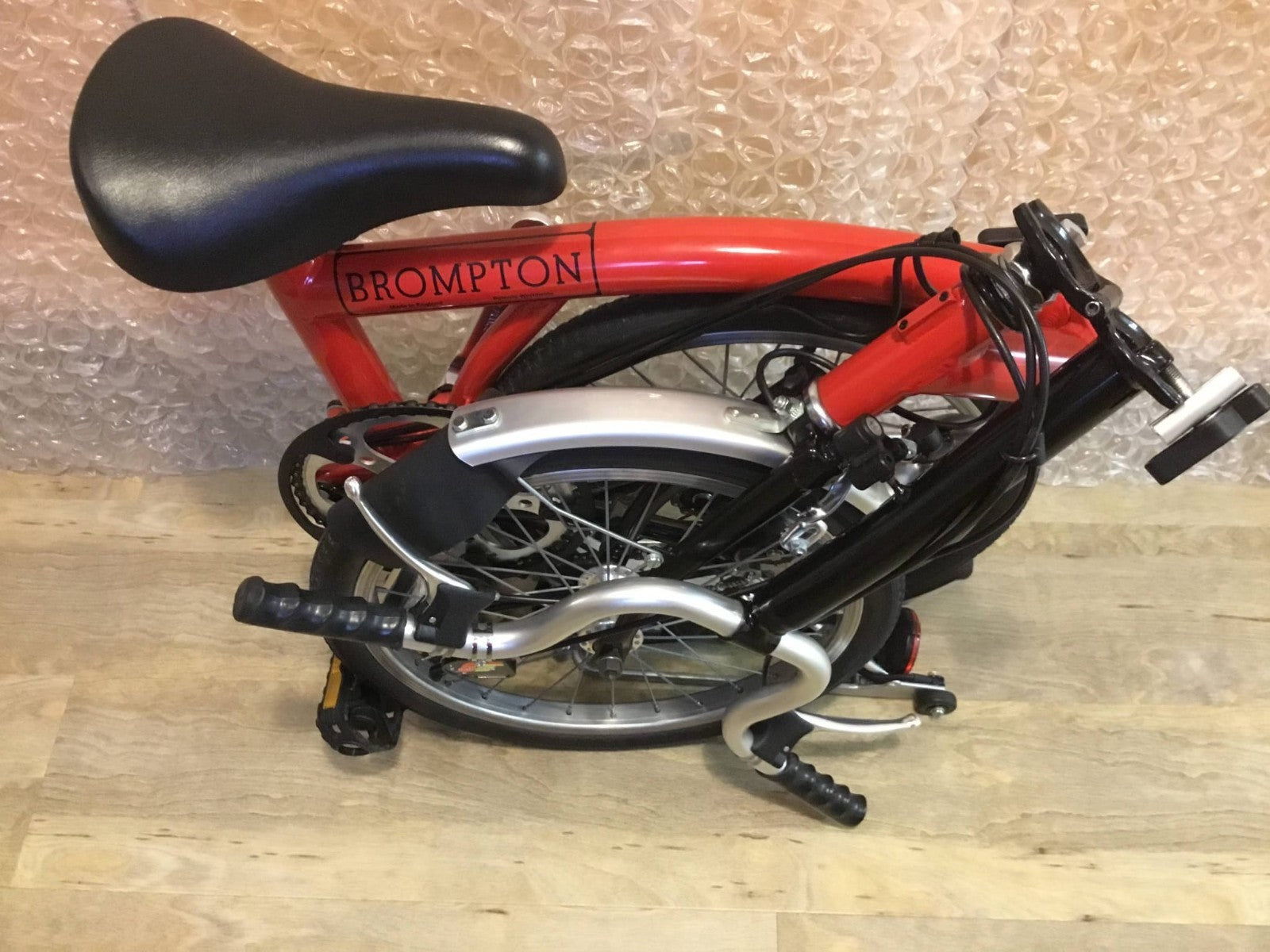 Brompton Folding Bike Red with Reflectors and Mudguards.