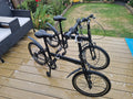 2x Black Folding Bikes w/ Mudguards, V-Brakes, Flat Bar, Grip Shifter