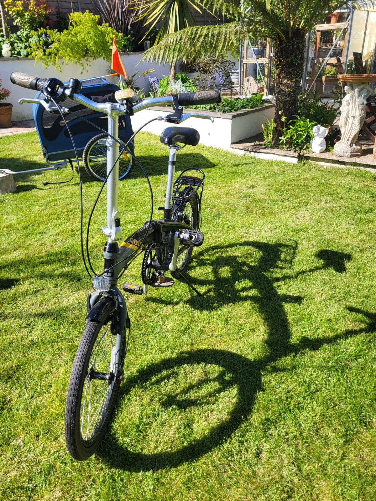 Compass Central  20in Folding Bicycles X  2, one white, one black.