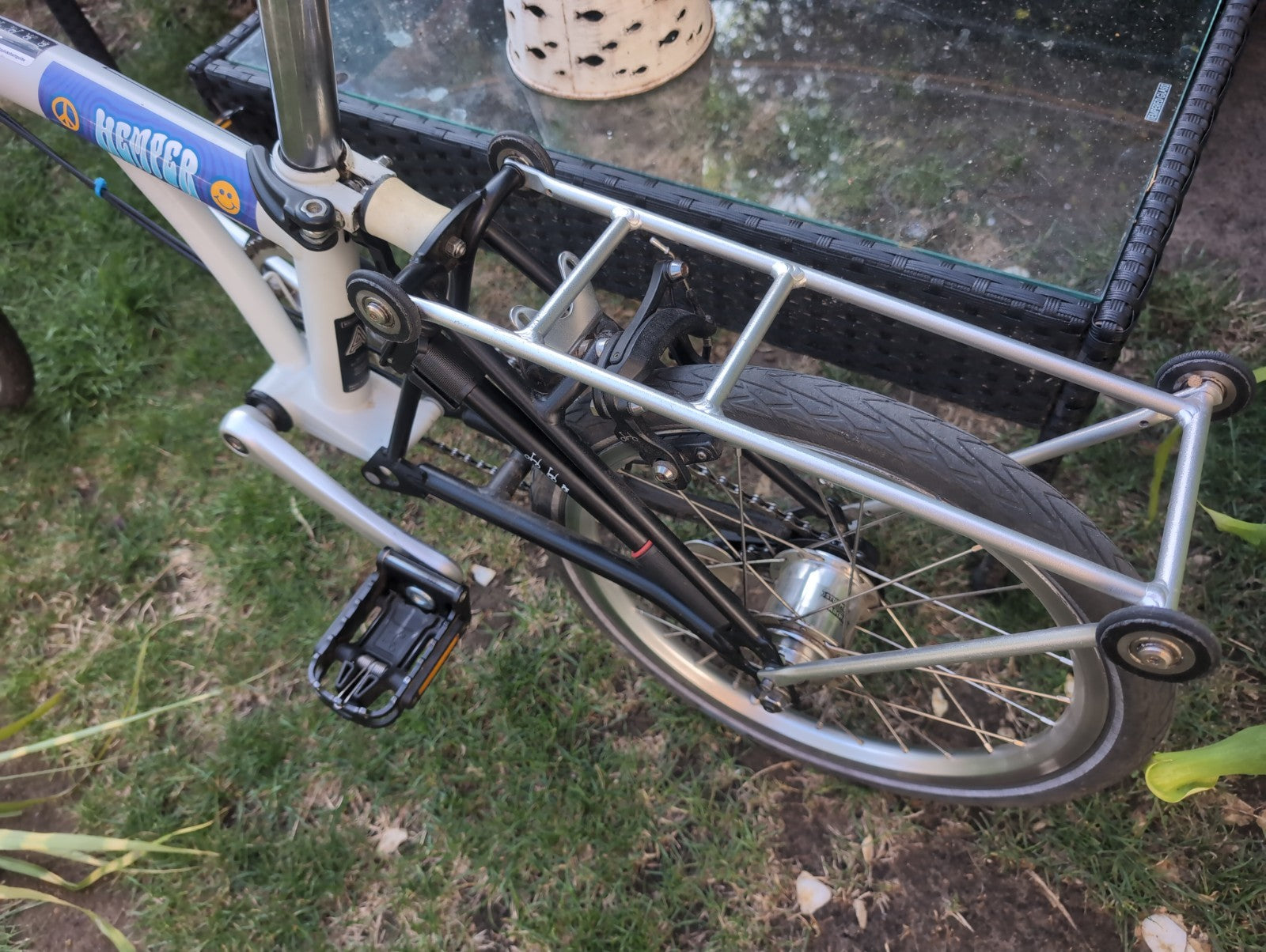 Brompton A line folding bike with led lights and wheel rack.