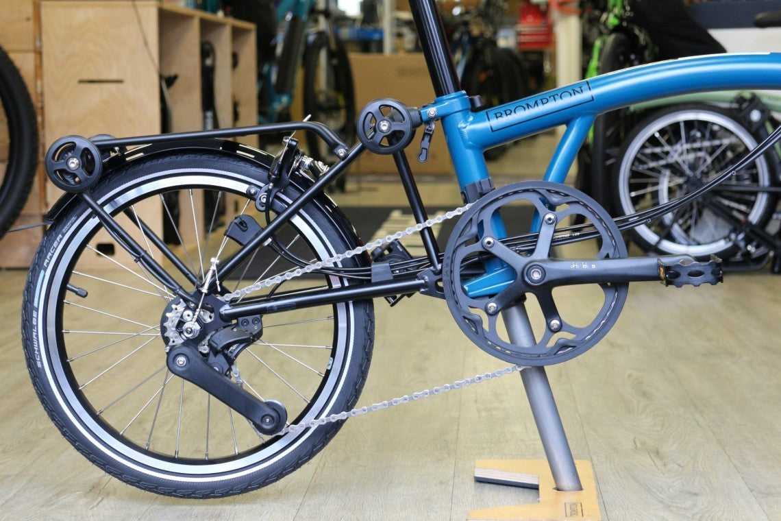 Brompton Electric C Line Explore Mid + Rack - 12 Speed - Ocean Blue Folding Bike