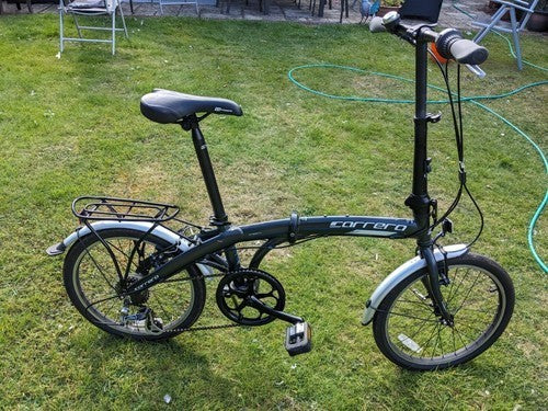 Halfords Carrera fold up bike in good condition. Rides well