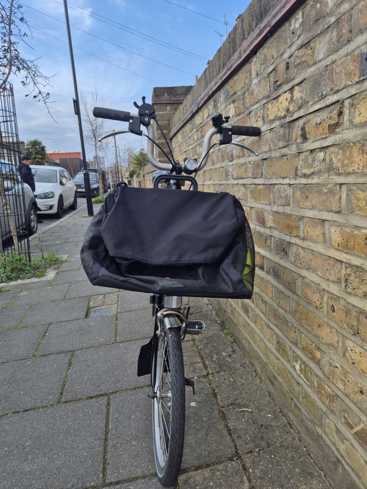 Brompton M3L folding bicycle in Satin Black with front bag.