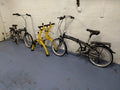 2x Moore Large Orus Folding 7 Speed Bikes + Saris Rack Bones 3-Bike Mount