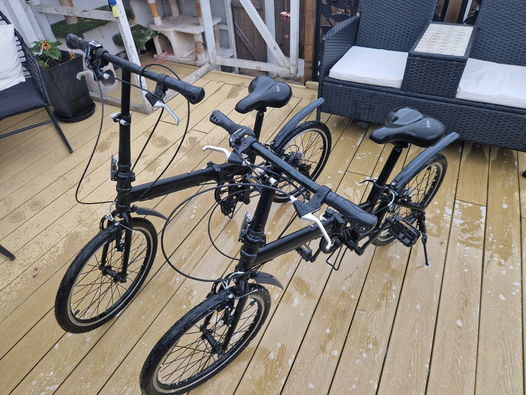 2x Black Folding Bikes w/ Mudguards, V-Brakes, Flat Bar, Grip Shifter
