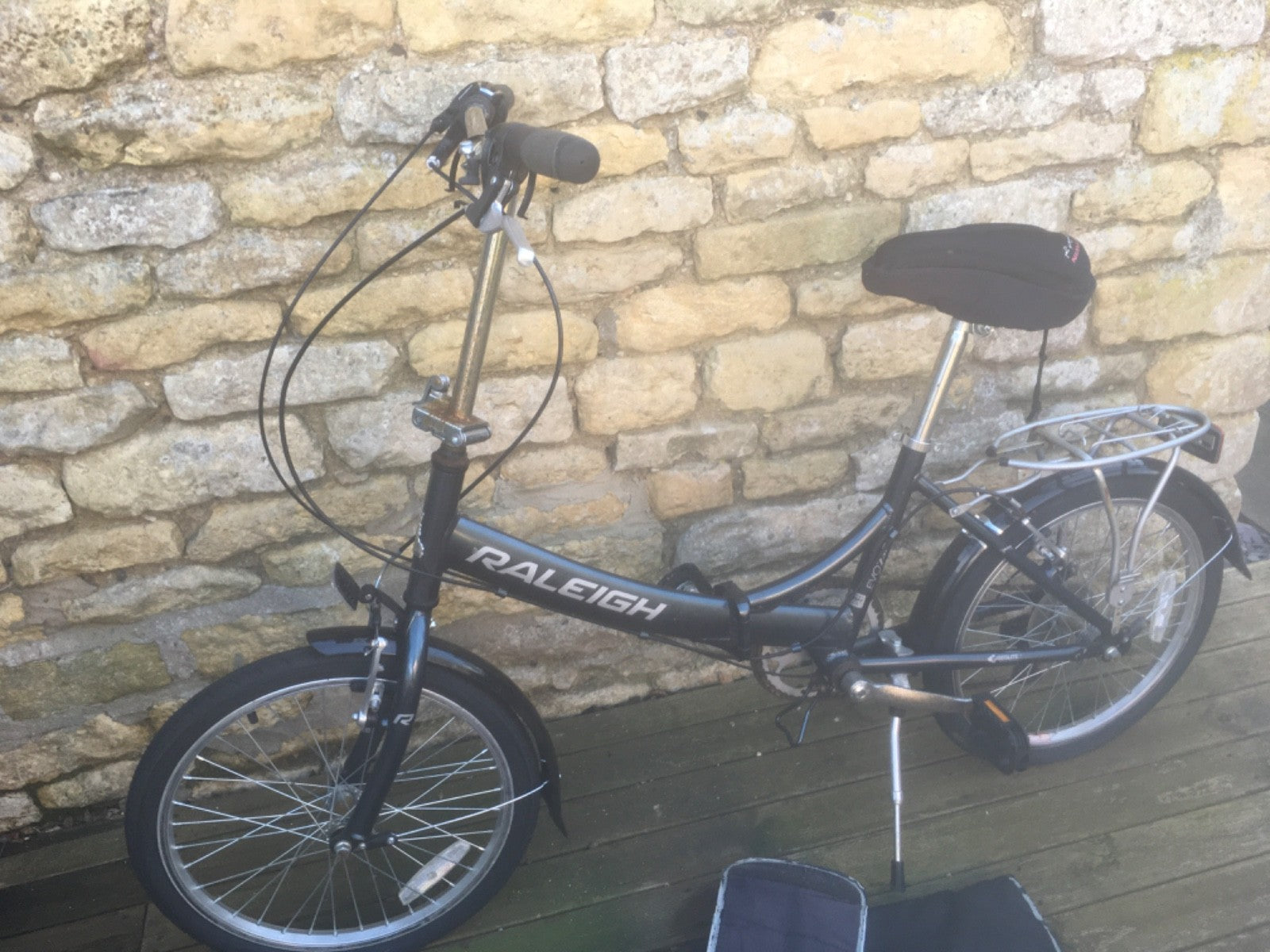 Raleigh Folding Bike plus cover.  Good condition