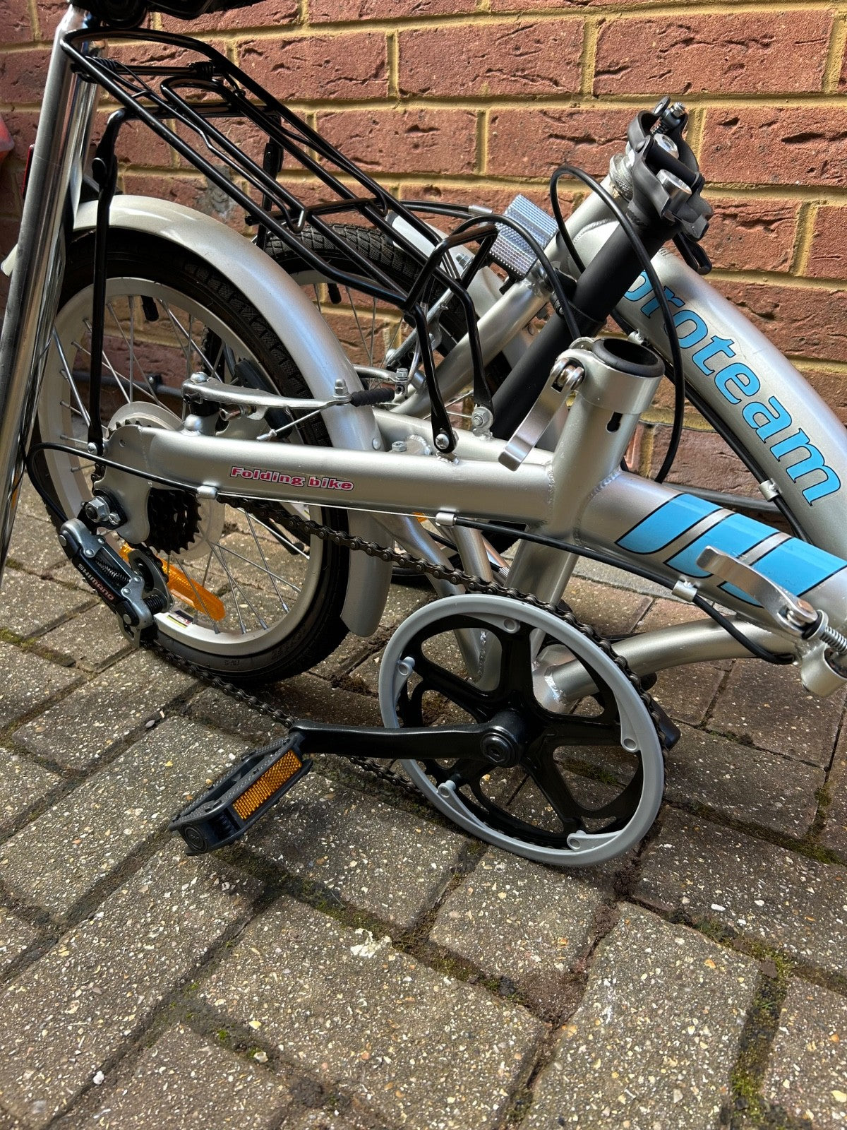 silver unisex fold up bike, aluminium alloy, never used