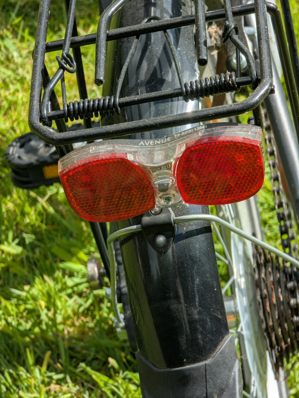 Folding Adult Bicycle with 7 speed Shimano gears, stand, lights, and pannier.