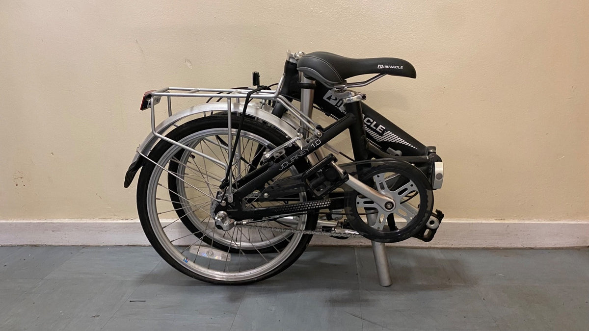 Pinnacle Journey 1.0 folding bike in matte black. Shimano Nexus 3-speed.