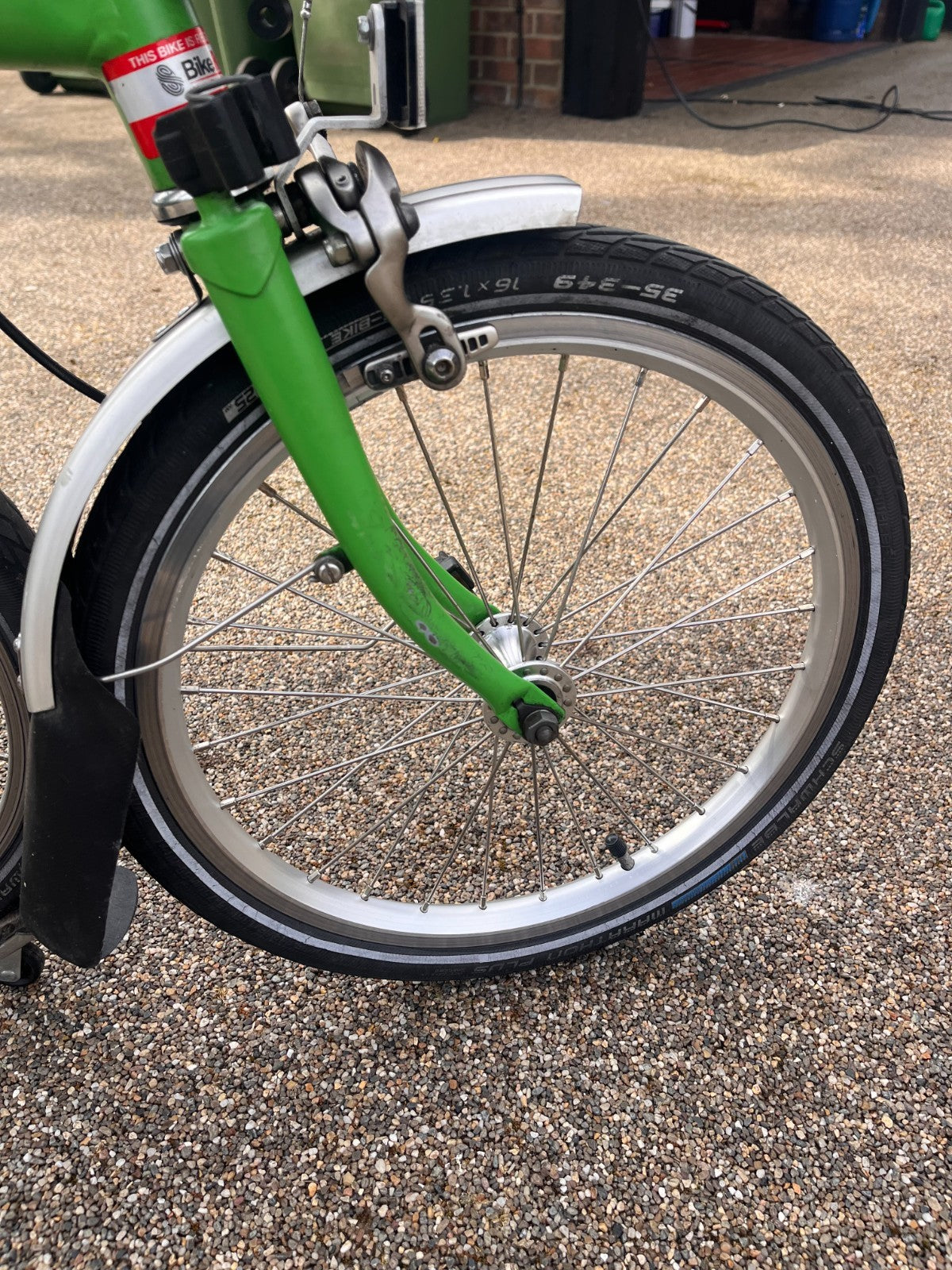 Lime green Brompton folding bike 3 speed