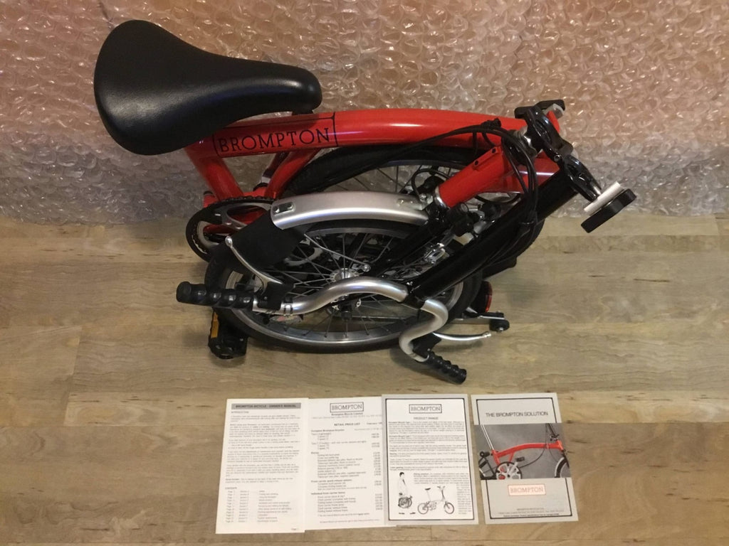Brompton Folding Bike Red with Reflectors and Mudguards.