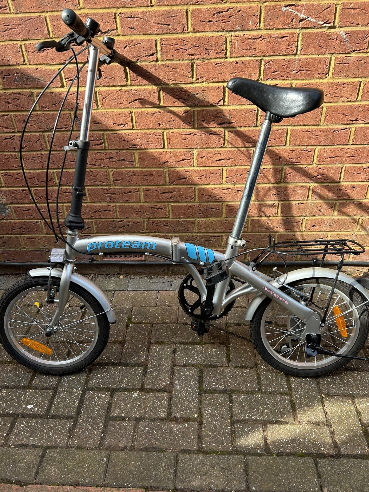 silver unisex fold up bike, aluminium alloy, never used