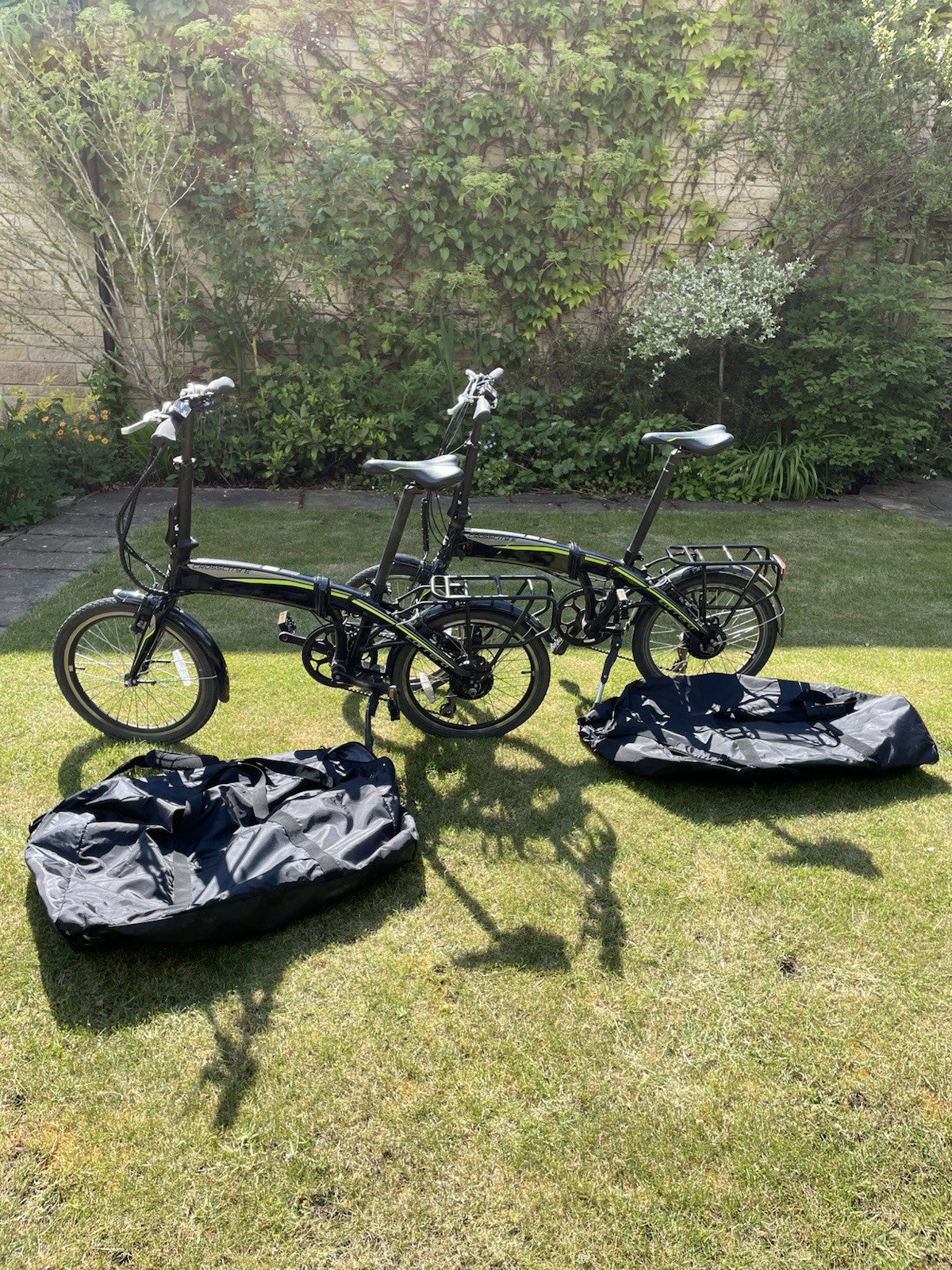2 X Carrera Crossfire Folding Bikes With Storage Bags.