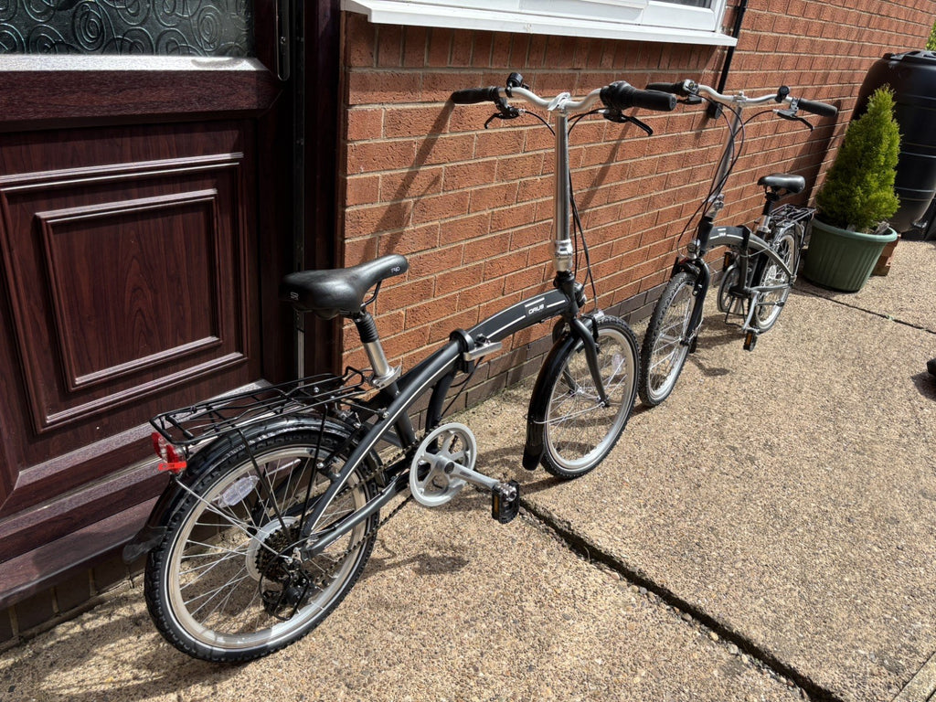 A Pair of Orus Folding Bikes with 20 Wheels one never used one used once
