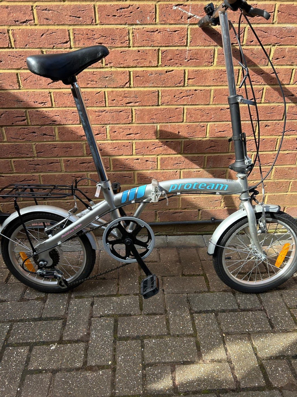 silver unisex fold up bike, aluminium alloy, never used