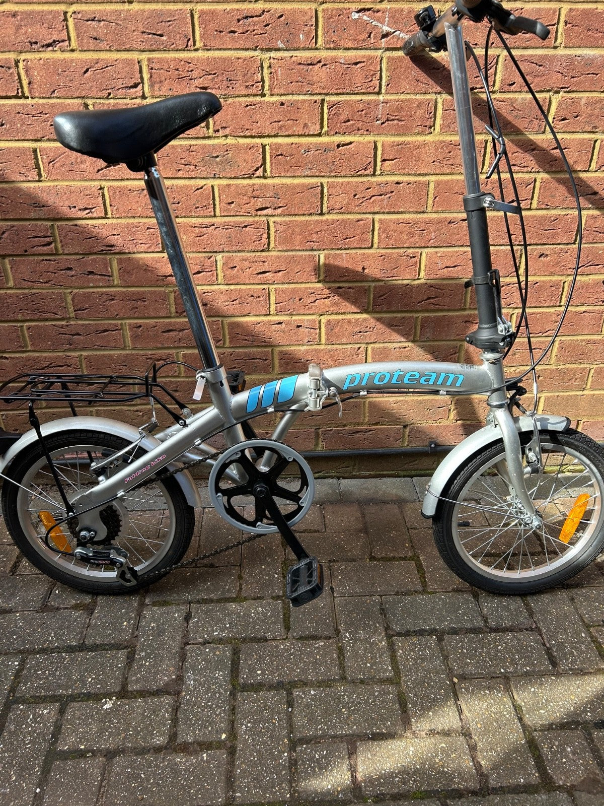 silver unisex fold up bike, aluminium alloy, never used