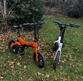 MiRider One Folding Electric Bikes Orange And White Pair.