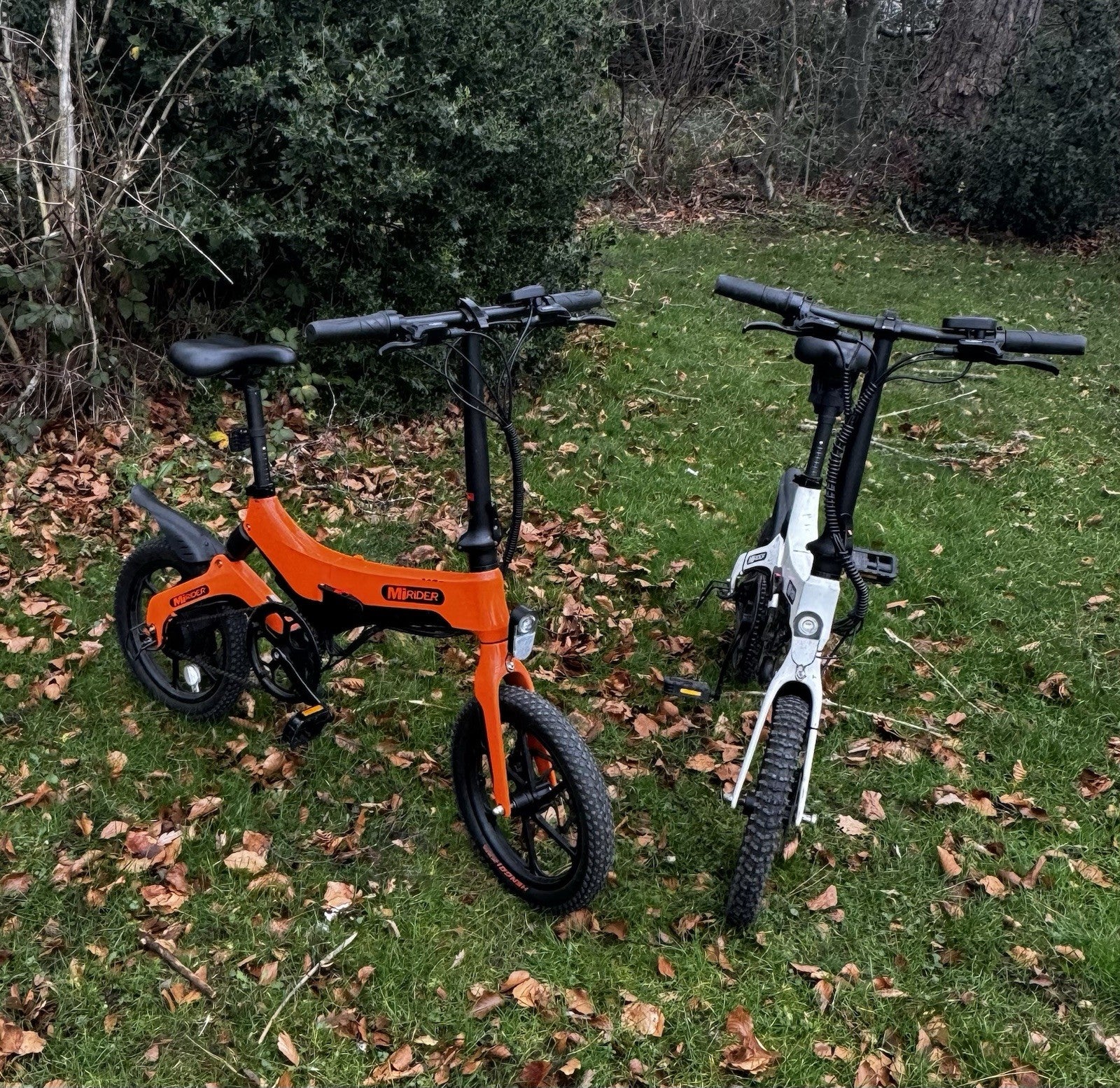MiRider One Folding Electric Bikes Orange And White Pair.