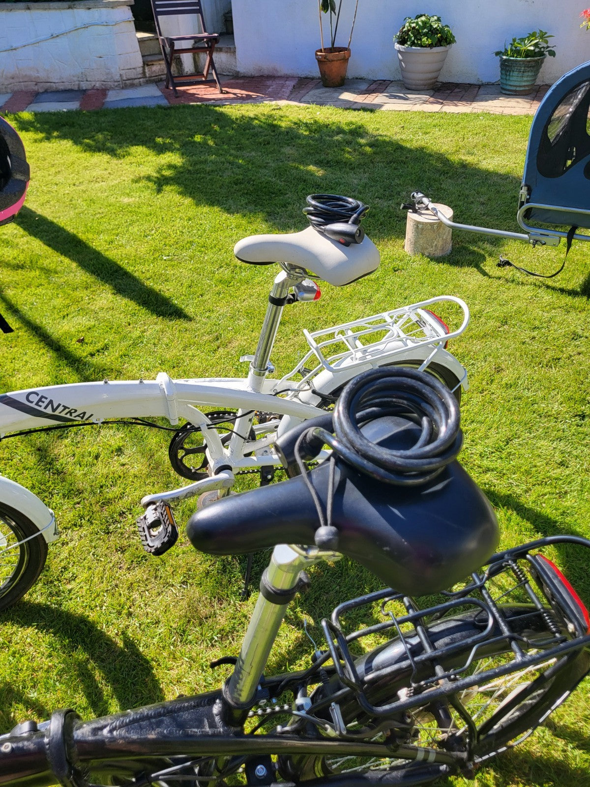 Compass Central  20in Folding Bicycles X  2, one white, one black.