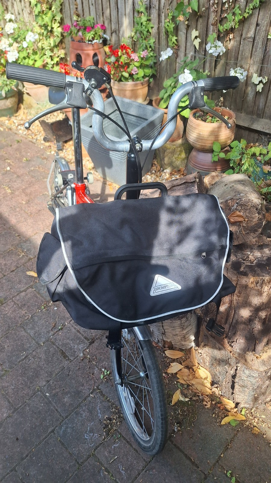 Brompton S3L Folding Bike 3-Speed . With front pannier bag and bike storage bag.