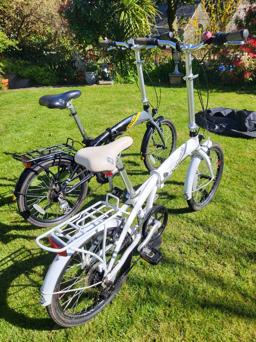 Compass Central  20in Folding Bicycles X  2, one white, one black.