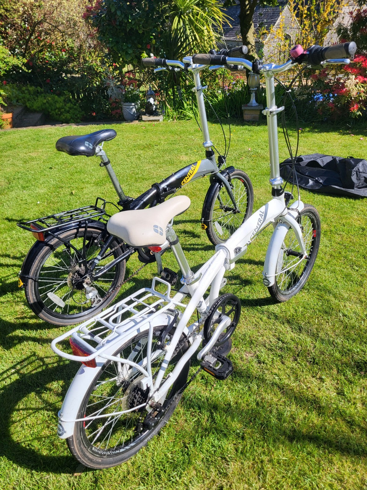 Compass Central  20in Folding Bicycles X  2, one white, one black.