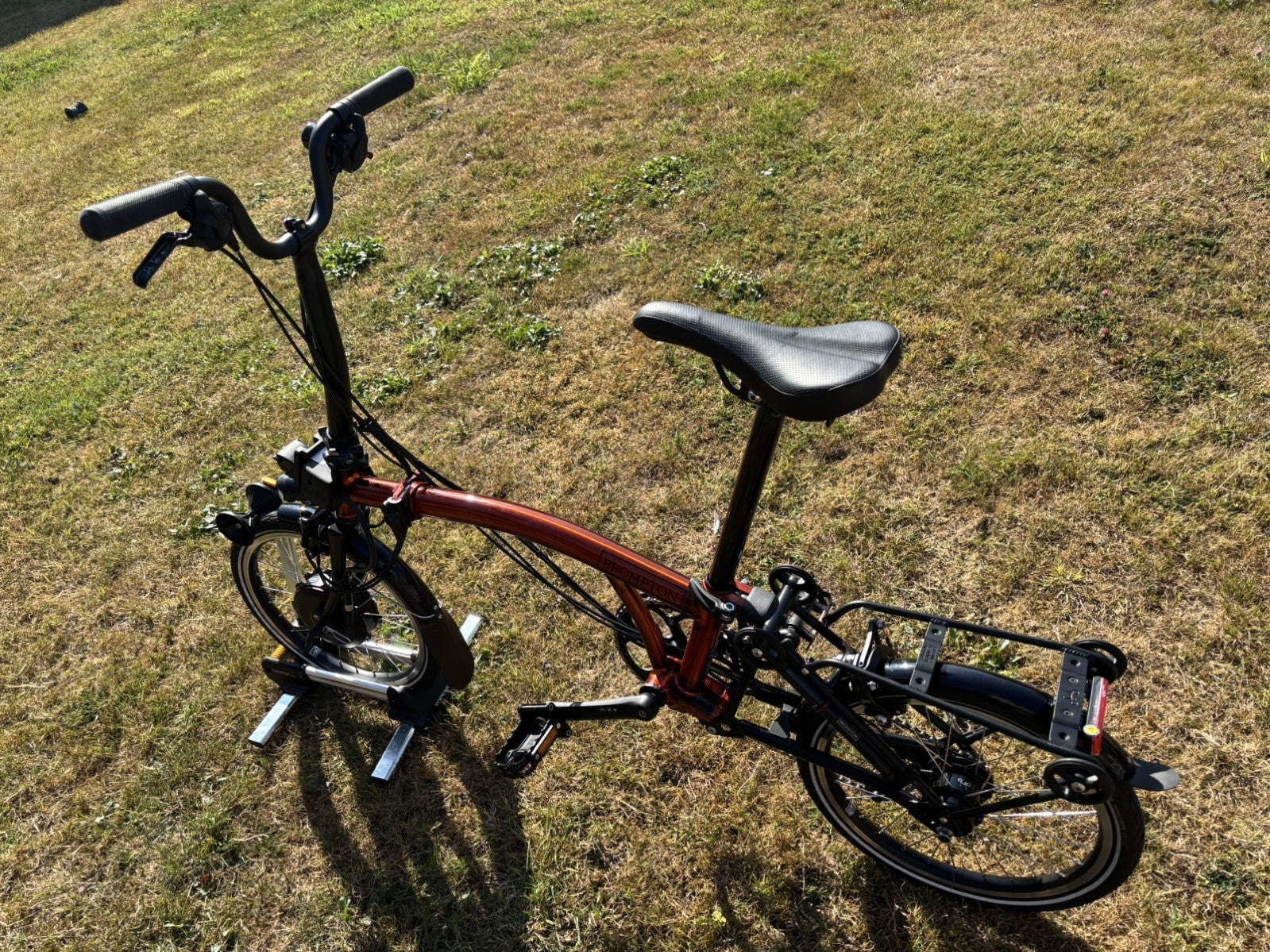 Brompton Electric C Line Explore Mid + Rack - 12 Spd - flame lacquer