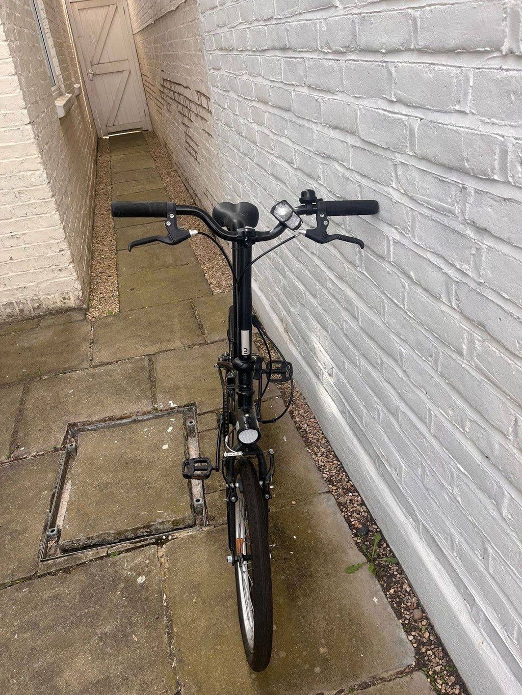 Black BTWIN folding bike