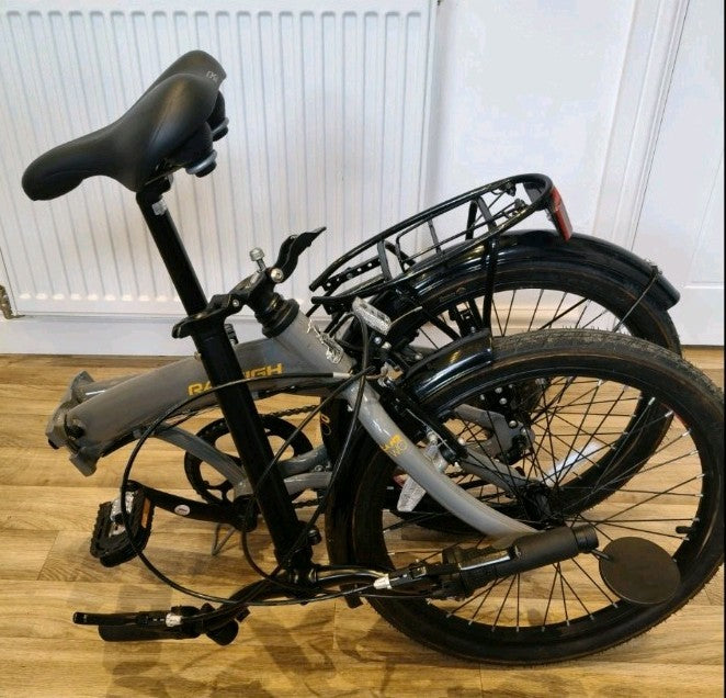 Raleigh Evo 2 is a folding bike featuring 7-speed Shimano gears and a grey frame